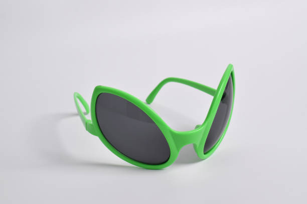 istock Green alien glasses on white background 2124614891