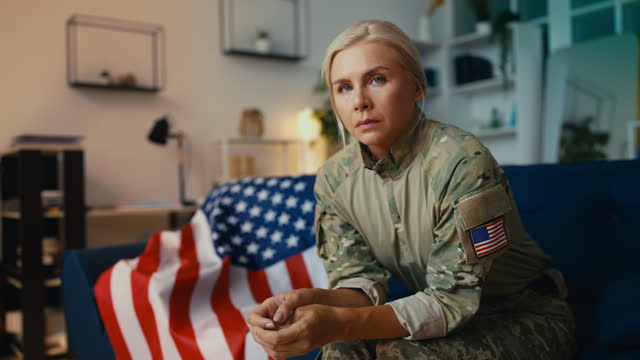 Upset U.S. female soldier suffering from PTSD, mental health problems, crisis