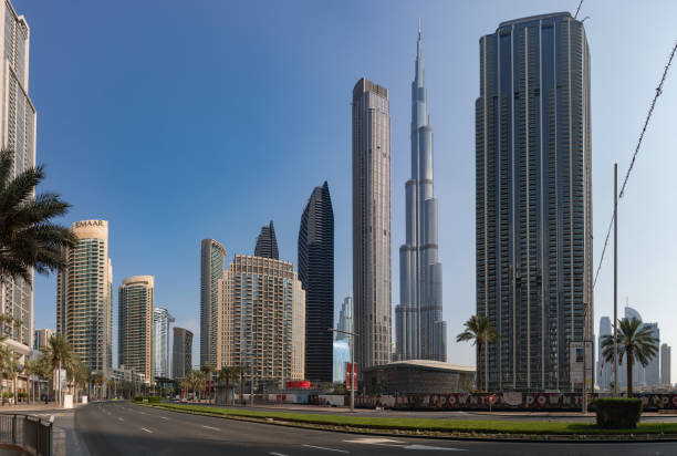 Dubai, United Arab Emirates - November 7, 2023: A picture of the Burj Khalifa towering nearby Downtown Dubai buildings.