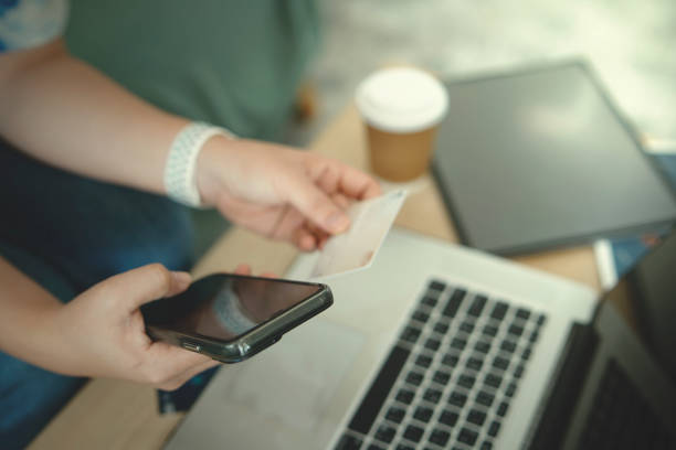 istock Women using laptop working and drinking coffee cup hot at cafe 2124680522