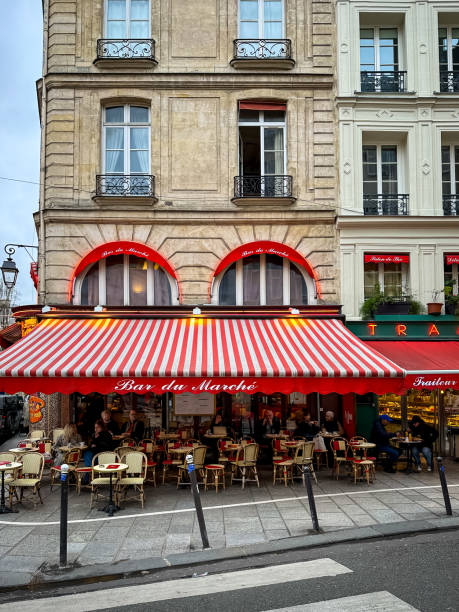 Paris, France - 19.02.2024. View of The Bar Du Marché in Paris. Located in the cross of Rue de Buci and Rue de Seine. 6th arrondisement of Paris, popular touristic area near Boulevard Saint Germain des Pres