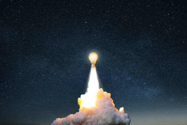 istock Creative burning light bulb rocket with blast and clouds of smoke successfully takes off into the starry sky. Creative idea, concept. Generation of new thoughts and ideas. Science and technology. 2124719271