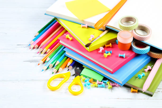istock School supplies on white wooden table 2124726440