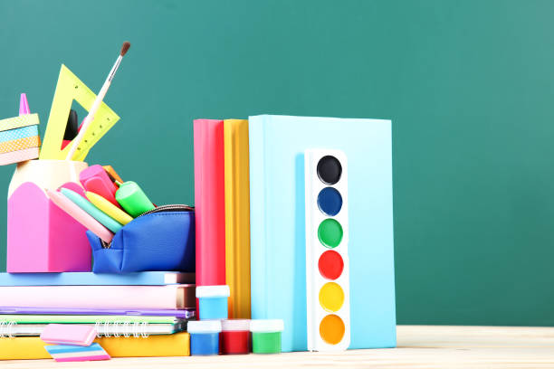 istock School supplies on chalkboard background 2124733112
