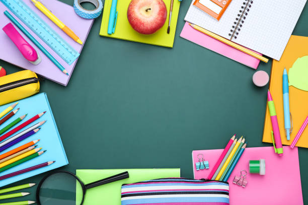 istock Different school supplies on chalkboard background 2124735790