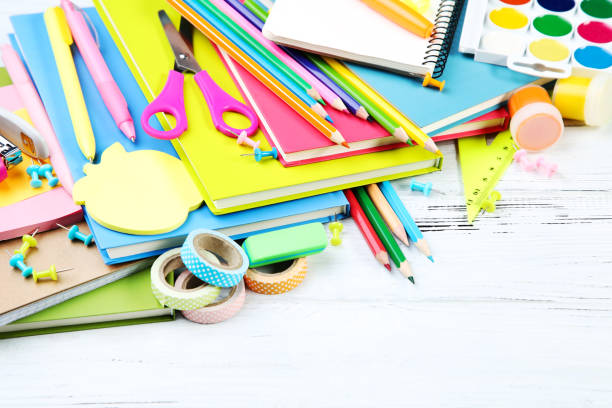 istock School supplies on white wooden table 2124740864