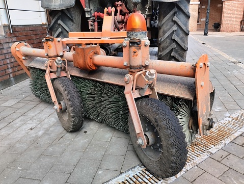 removable mechanism on a tractor for street cleaning