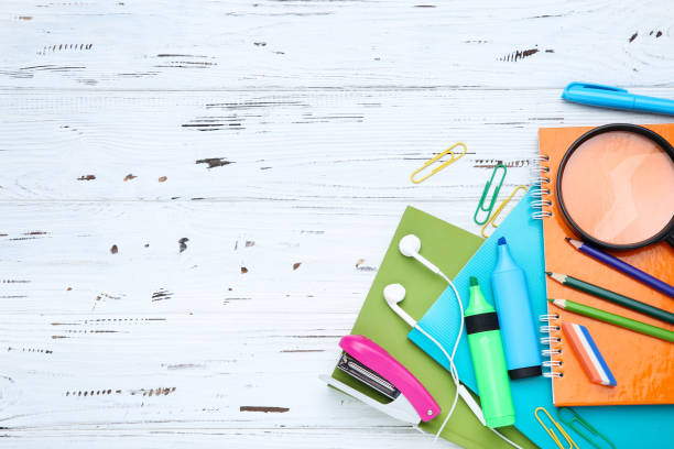 istock Different school supplies on white wooden background 2124769069