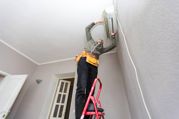 istock Male technician cleaning air conditioner indoors 2124770953