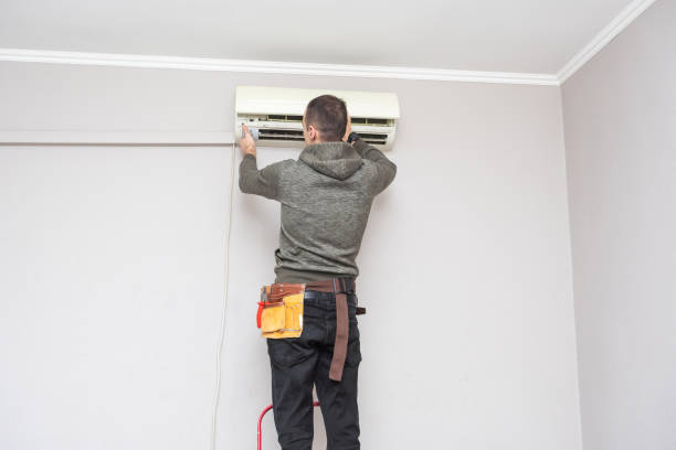 istock Male technician cleaning air conditioner indoors 2124784314