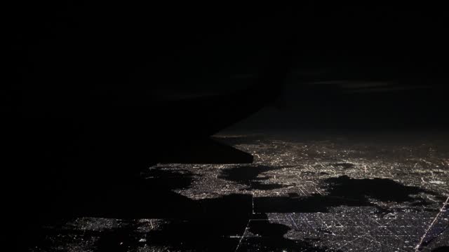 Shot of airplane flying over mexico city