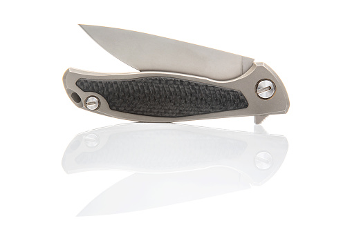 An overhead side view of an old Army boot knife, isolated on a white background with copy space.