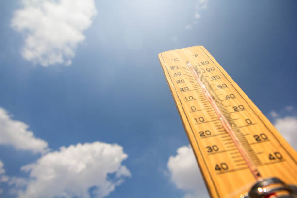 Thermometer background is blue sky Thermometer background is blue sky Content on global warming fever stock pictures, royalty-free photos & images