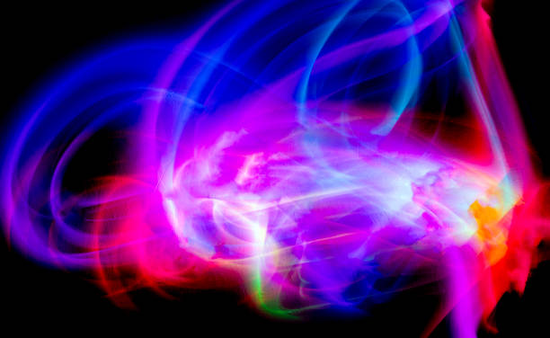 istock Abstract colorful irregular lines on black background and wall texture. Long exposure. Light painting photography. 2124923234