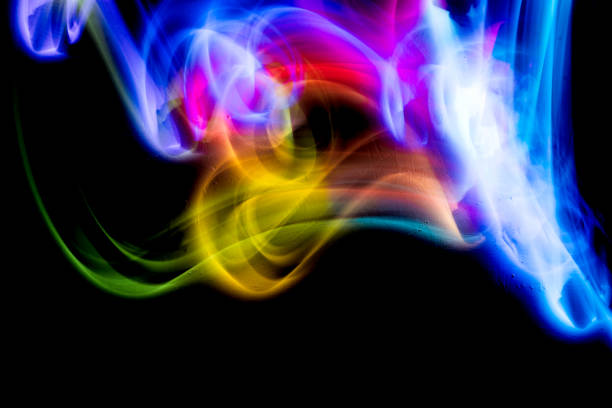 Abstract colorful irregular lines on black background and wall texture. Long exposure. Light painting photography.