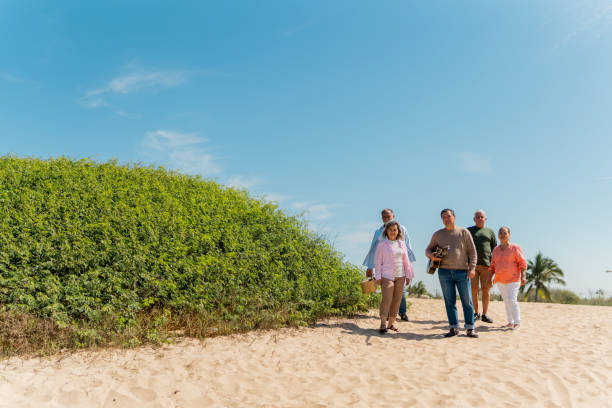 istock Senior friends arriving at the beach 2124930086
