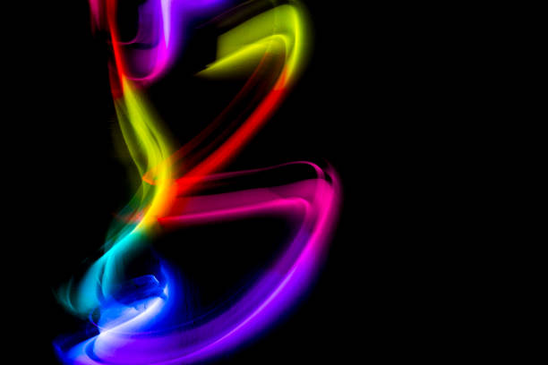 istock Abstract colorful irregular lines on black background and wall texture. Long exposure. Light painting photography. 2124931144