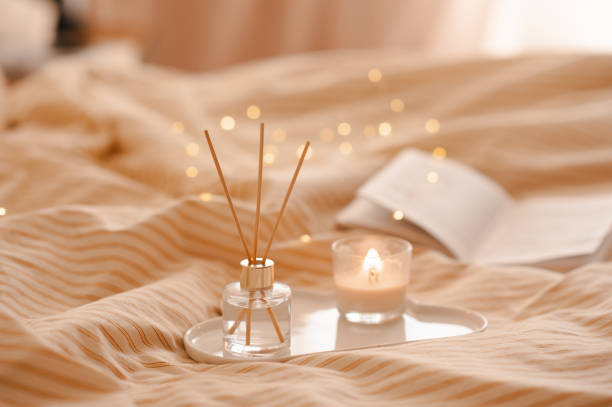 Cozy home atmosphere with liquid fragrance in bed