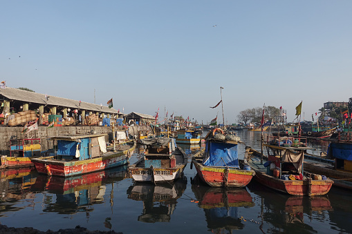 Fishing boats moor in the harbor in Sassoon Docks which is one of the oldest docks in Mumbai and was the first wet dock constructed, It is one of largest fish markets in Mumbai City