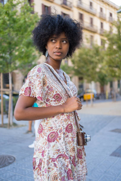 istock Woman posing with her vintage camera 2124953045