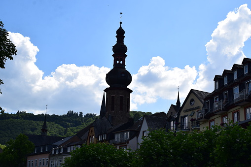 Tree Line And Clocktower Of St. Florin Cathedral In Vaduz, Liechtenstein