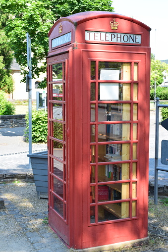 happiness woman in the telephone booth in london