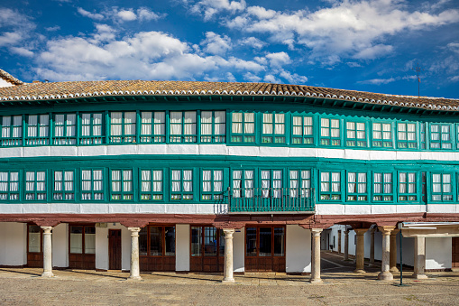 Detail of the unique houses with green glazed windows and porticoes of the Plaza Mayor of Almagro, Ciudad Real, Castilla la Mancha, Spain