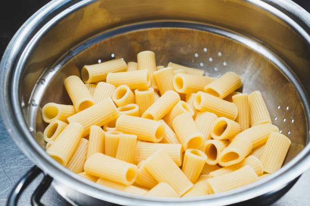 istock Cooked maccheroni pasta, drained in a colander 2125081523