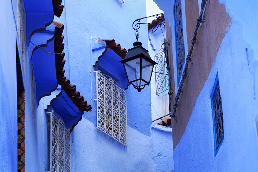 View of the streetlight of Medina quarter in Chefchaouen, Morocco. The city, also known as Chaouen is noted for its buildings in shades of blue and that makes Chefchaouen very attractive to visitors.