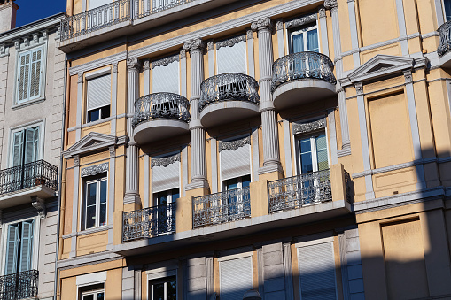 Details of one of the old historic buildings in the city center of Cannes on a summer sunny day. France.