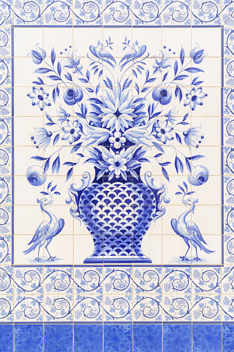 blue fresco of ceramic tiles adorning a wall in blue and white colours
