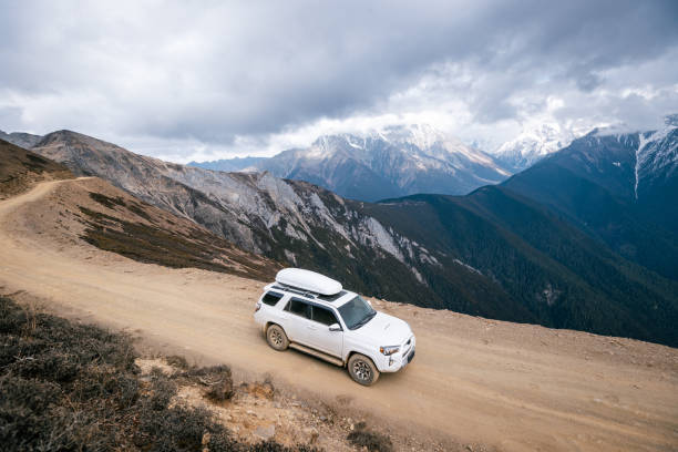 istock Driving car on high altitude mountain trail, China 2125117016