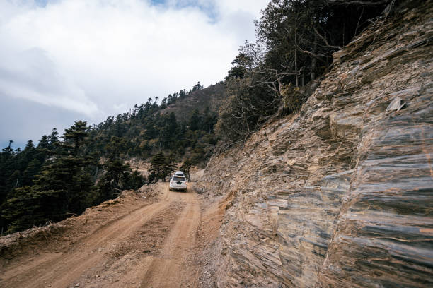 istock Driving car on high altitude mountain trail, China 2125117570
