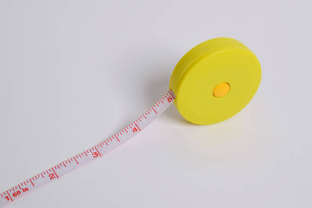 Cloth measuring tape isolated on white background. Tailor's sewing fabric measuring tool
