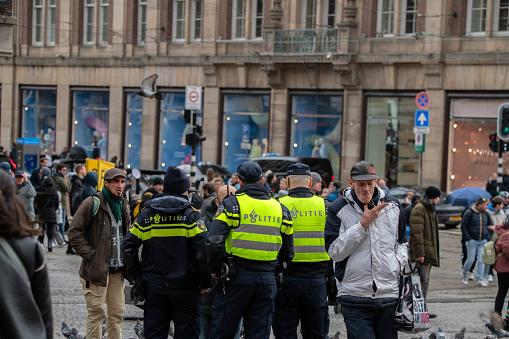 Group Of Police Men At The Dam Square At Amsterdam The Netherlands 23-3-2024