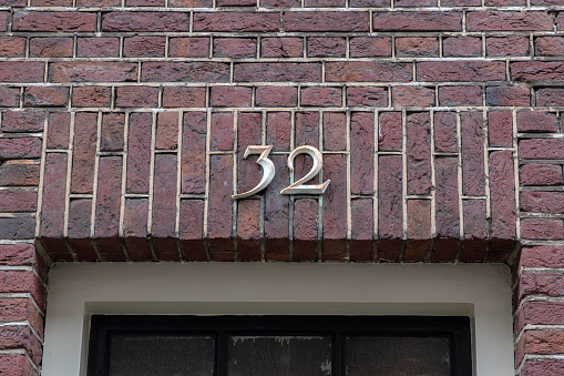Close Up House Number 32 At Amsterdam The Netherlands 23-3-2024