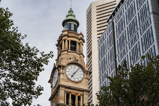 Sydney, NSW, Australia, February 21st 2024. Historic clock tower of the Australia Post Sydney GPO, with modern buildings in the background.