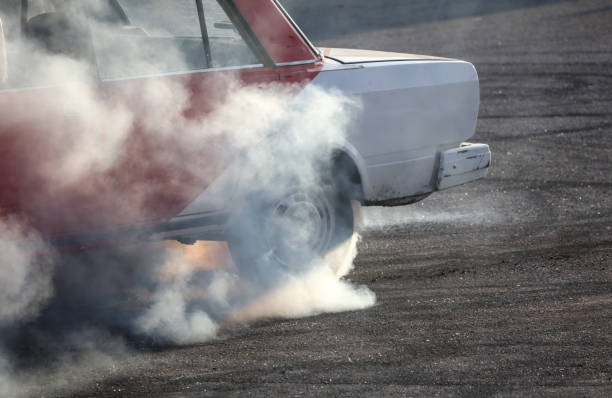 istock Smoke from under the wheel of a car 2125139043