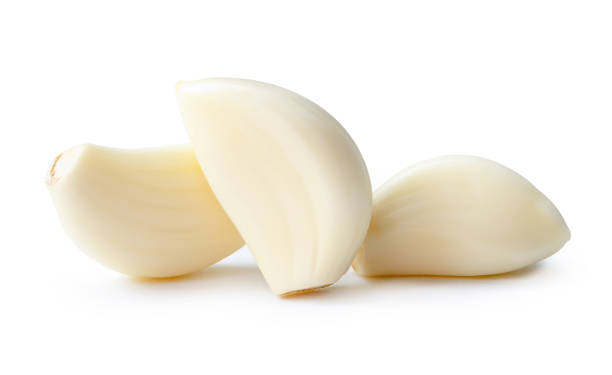 istock Front view of garlic cloves or slices in stack isolated on white background with clipping path 2125143809