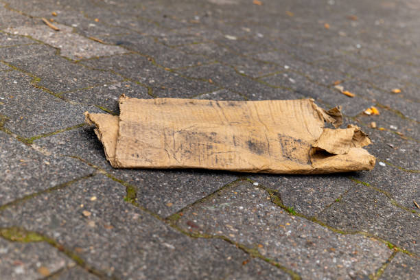 cardboard waste in the city on a footpath in selective focus