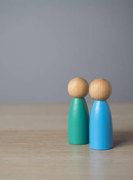 istock Two human figures stand together. Assistance, cooperation and collaboration. A meeting. Friendly relations. Communication and discussion. Make friends. A team 2125171503