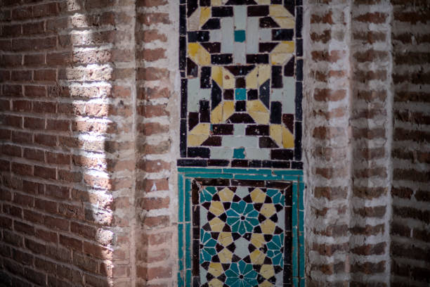 Close-up of a mosaic tile pattern on a brick wall