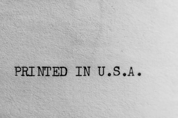 istock Printed in U.S.A. Text Only Idea Minimal Close-up Black on Textured White Paper 2125203728