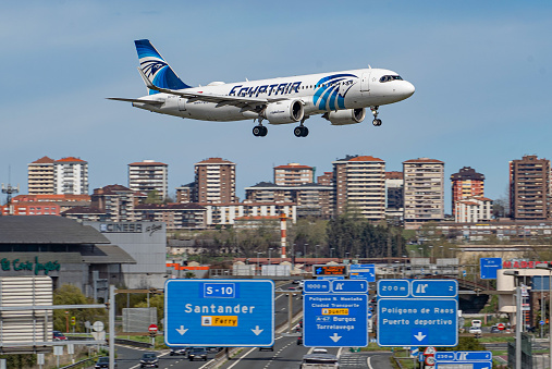 Airbus A320NEO passenger transport plane of the Egyptian airline Egyptair about to land at the Santander international airport, in Spain. Concept: travel, air transportation, aerospace engineering