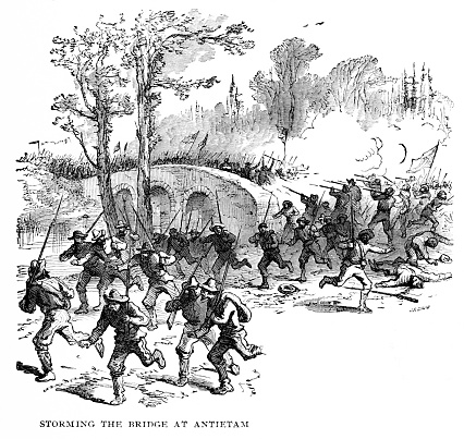 Storming the Bridge at Antietam, Maryland, USA, during the American Civil War. Engraving of photograph published 1896. This edition is in my private collection. Copyright is in public domain.