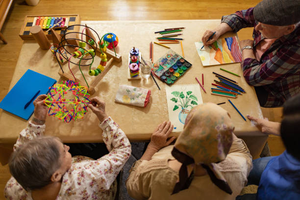 istock Seniors coloring in nursing home 2125222206