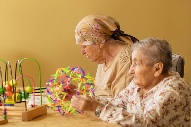 istock Seniors at Play in Nursing Home 2125223757