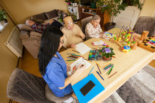 istock Seniors Enjoy Art Therapy in Nursing Home 2125228481