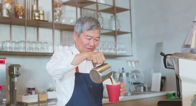 elderly male barista making coffee