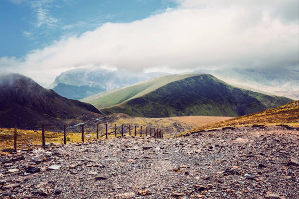 Mountain trail up Snowdon mountain near Llanberis in North Wales, United Kingdom. This section is on the main tourist route from Llanberis which follows the railway track.